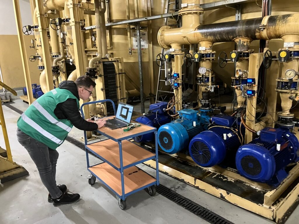 Techworks engineer measuring the parameters of a pumping station
